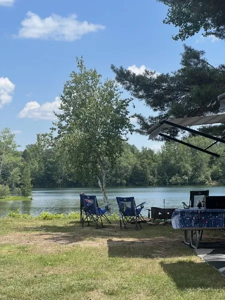 Camp chairs set out for a quiet evening by the water